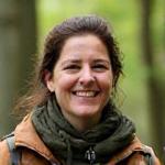Portrait of Sarah Jenkins, a friendly naturalist in outdoor gear.